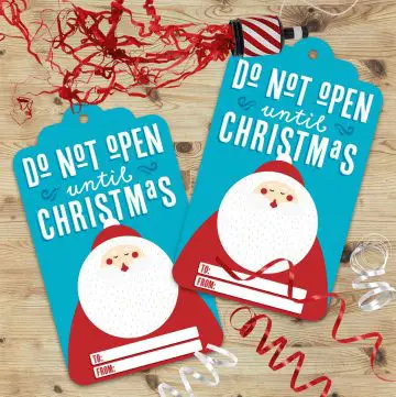 gift tag mockup with text "Do not open until Christmas" on a blue background along with an illustration of Santa Claus
