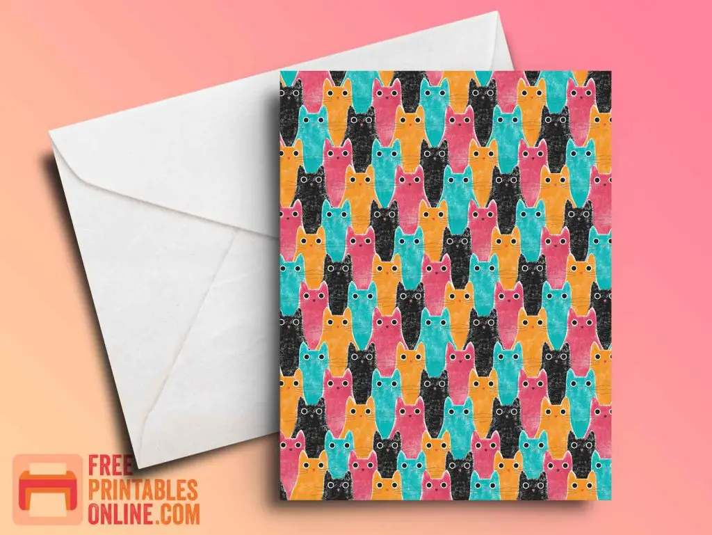 mockup image of a cat pattern greeting card. The cats are pink, orange, black, and blue.